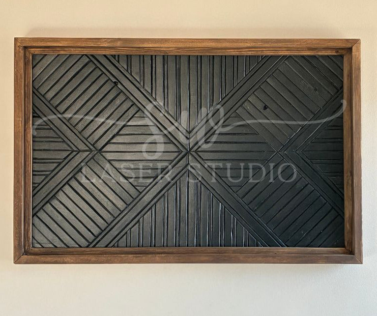 Decorative wall art with geometric pattern in a wooden frame on a beige wall.